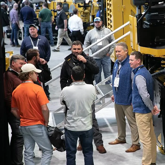 Guy registering at the world of asphalt desk